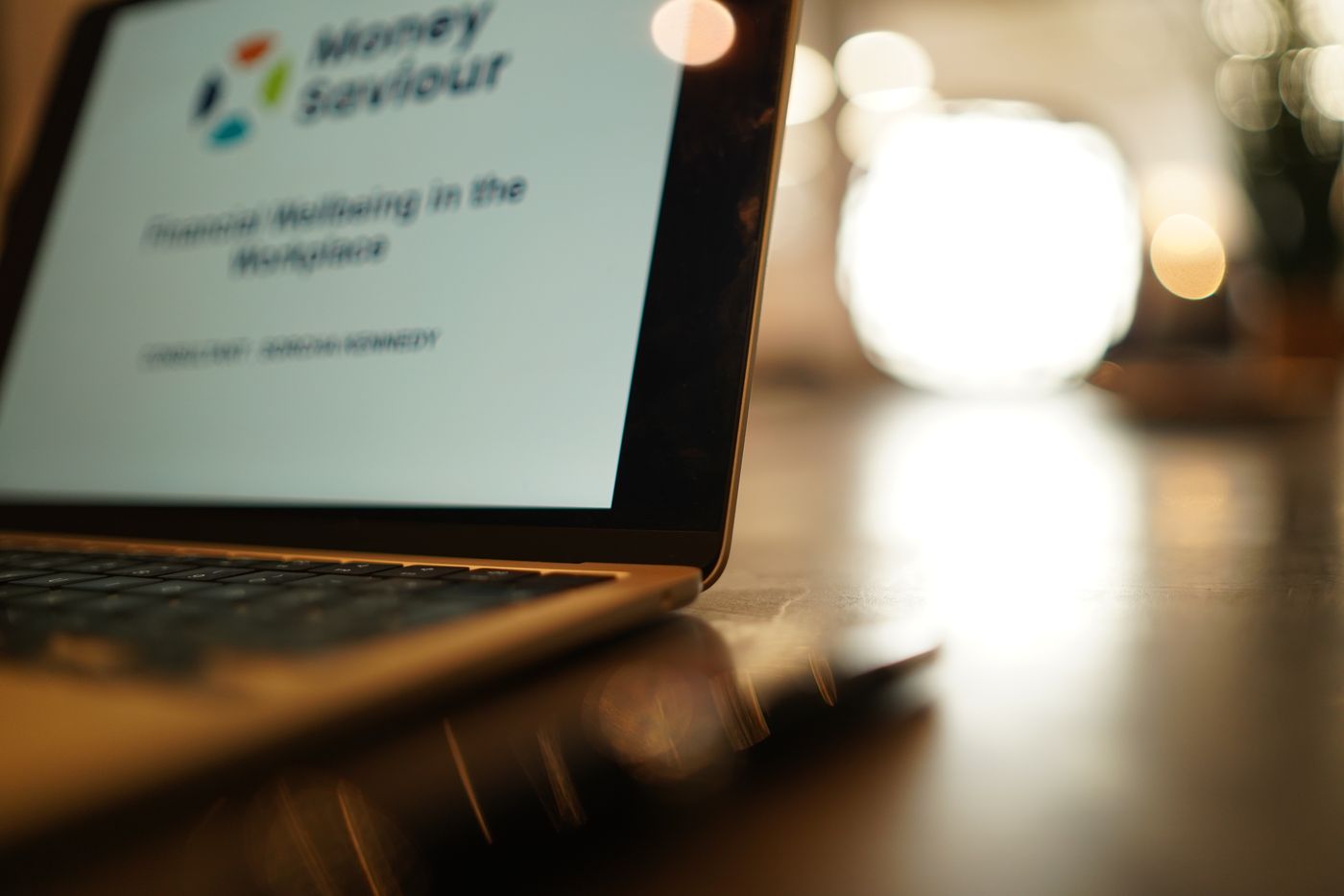 Laptop showing a Money Saviour Financial Wellbeing in the Workplace presentation