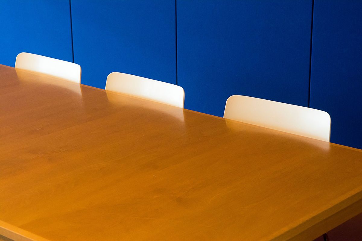 A training room set up with a long table and chairs